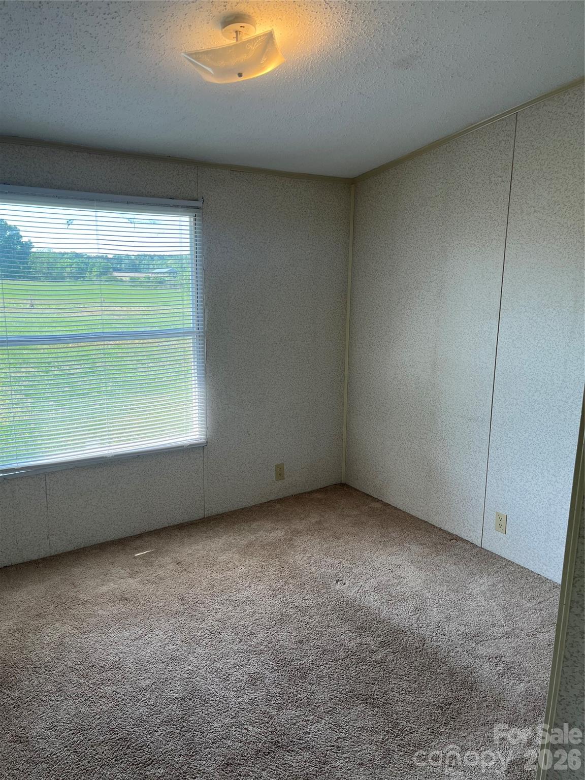 28616 Canton Road Albemarle, NC 28001 - Photo 25 of 31 a view of an empty room with a window