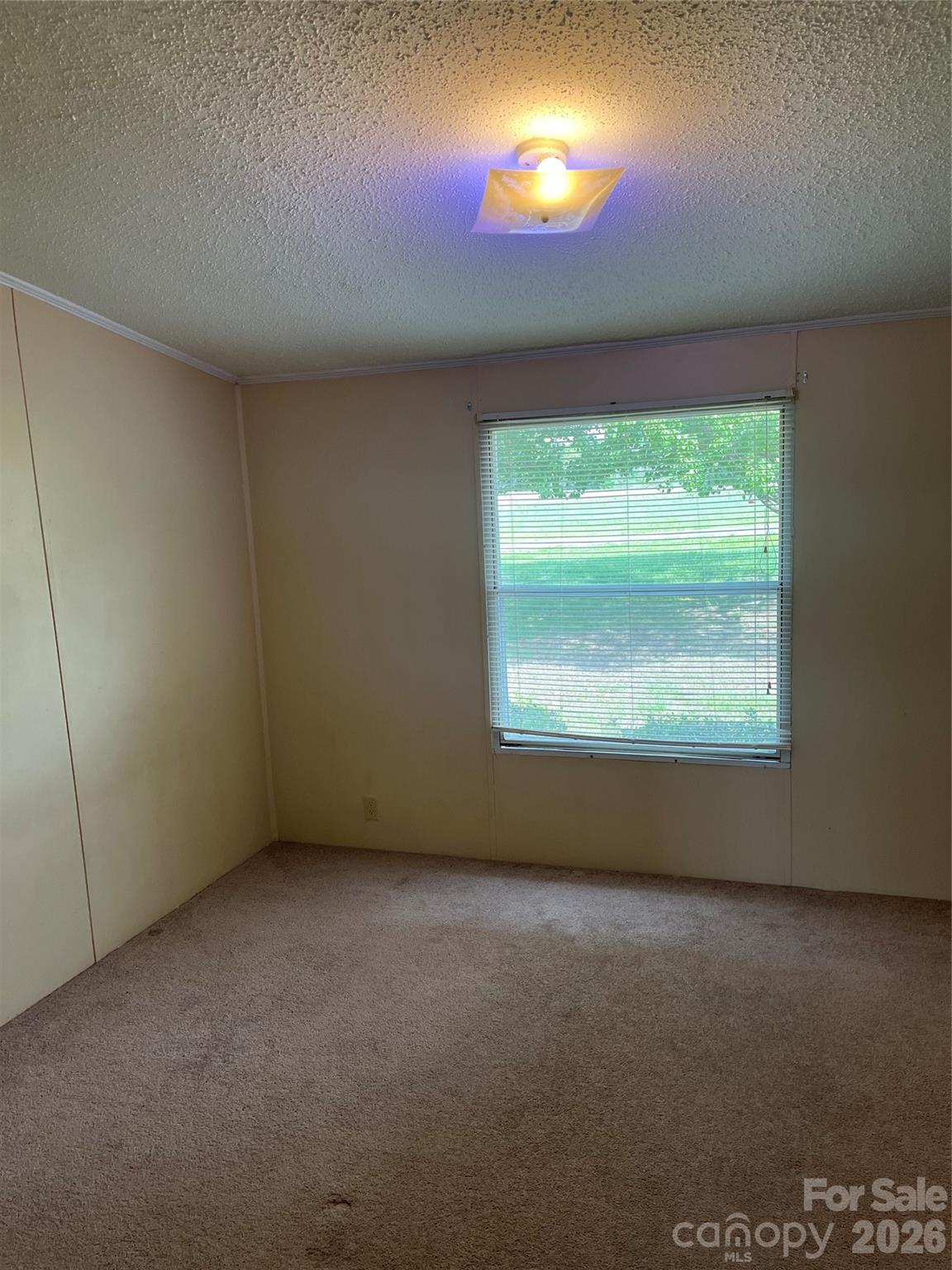 28616 Canton Road Albemarle, NC 28001 - Photo 26 of 31 an empty room with a window and doors