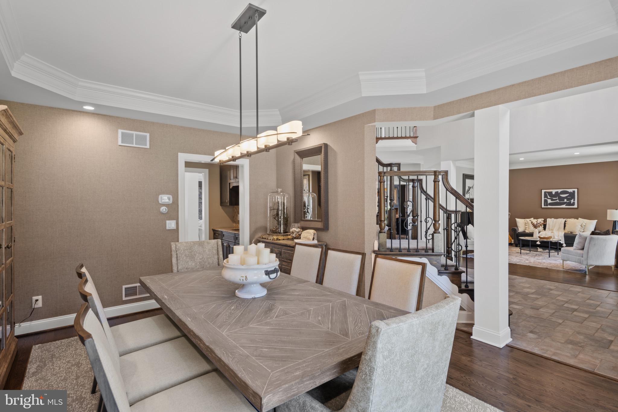 1140 Bernoudy Road White Hall, MD 21161 - Photo 15 of 81 a view of a dining room and livingroom with furniture wooden floor a chandelier