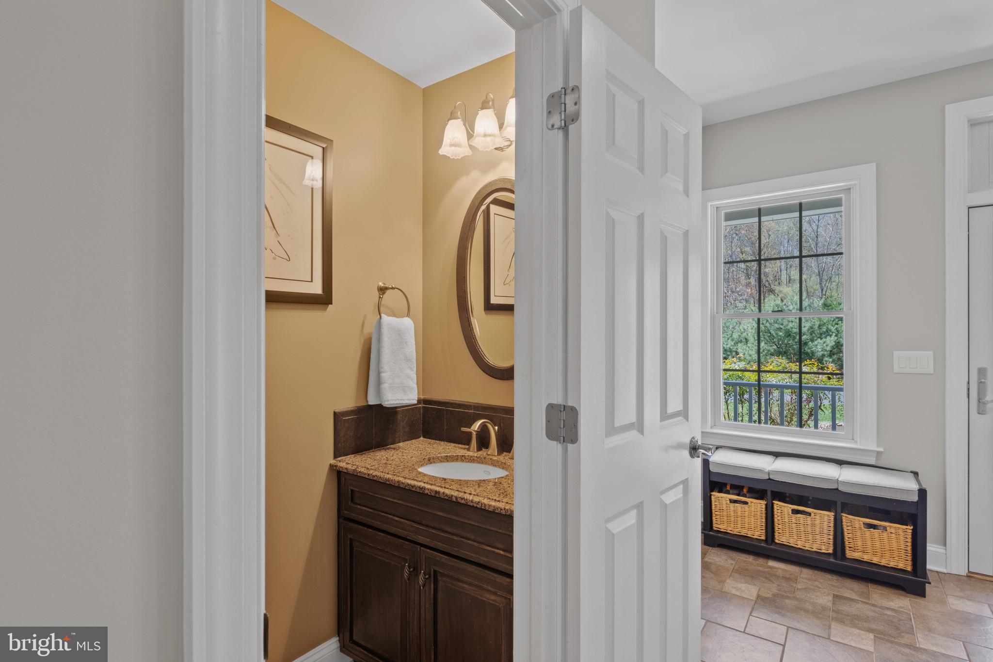 1140 Bernoudy Road White Hall, MD 21161 - Photo 27 of 81 a bathroom with a granite countertop sink and a mirror