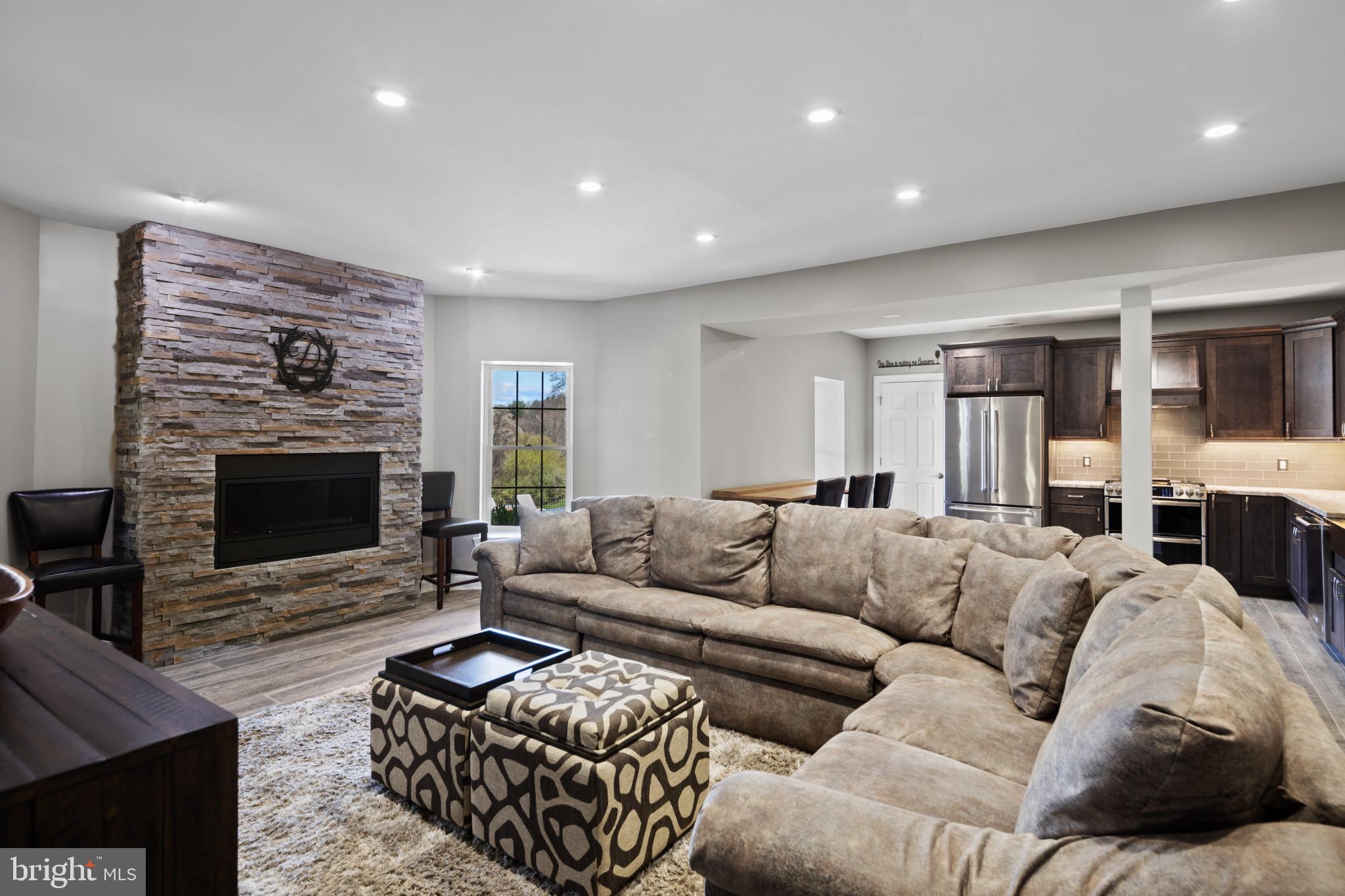 1140 Bernoudy Road White Hall, MD 21161 - Photo 47 of 81 a living room with furniture couch and a fireplace