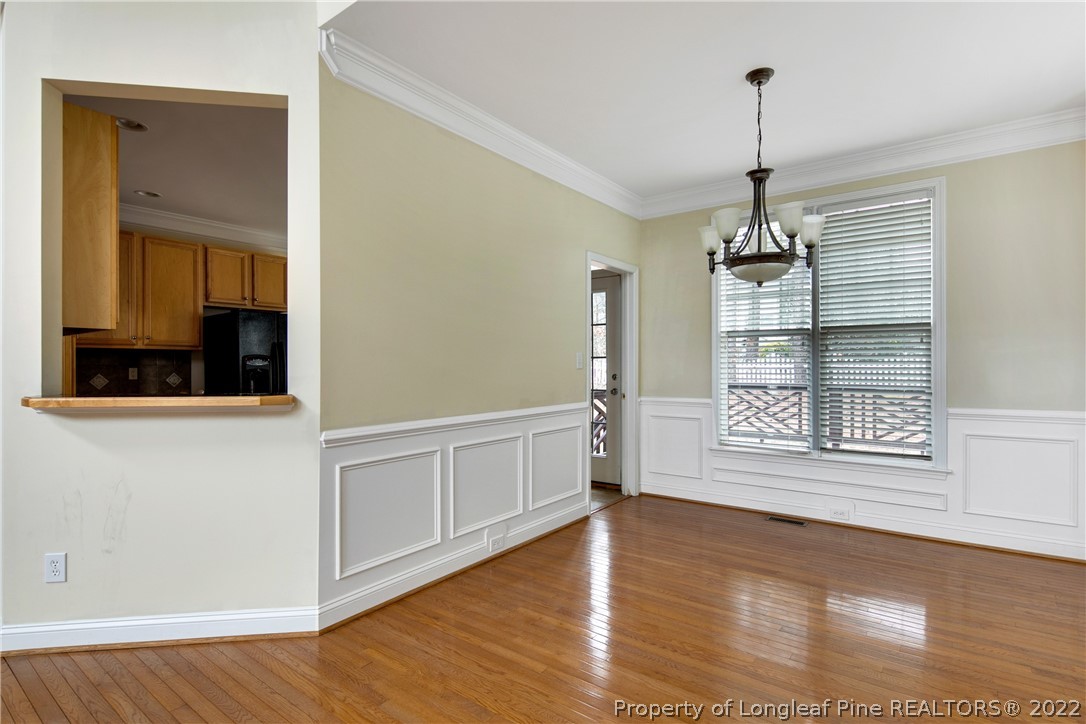 187 Lamplighter Way Spring Lake, NC 28390 - Photo 11 of 48 a view of an empty room with a window and wooden floor