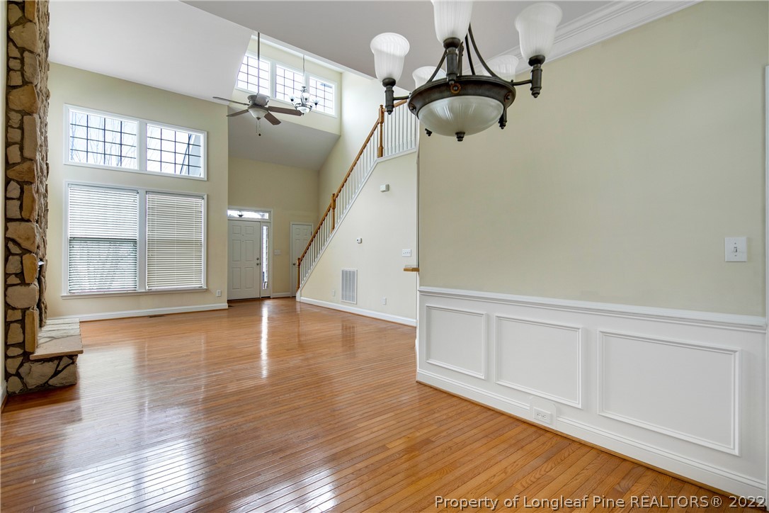 187 Lamplighter Way Spring Lake, NC 28390 - Photo 12 of 48 wooden floor in an empty room with a window