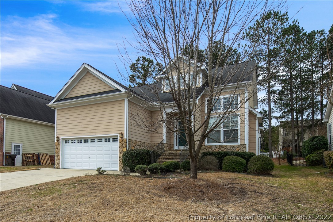 187 Lamplighter Way Spring Lake, NC 28390 - Photo 2 of 48 a view of a house with a tree and a yard