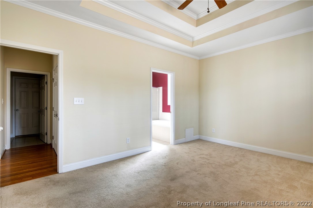 187 Lamplighter Way Spring Lake, NC 28390 - Photo 23 of 48 an empty room with wooden floor and windows