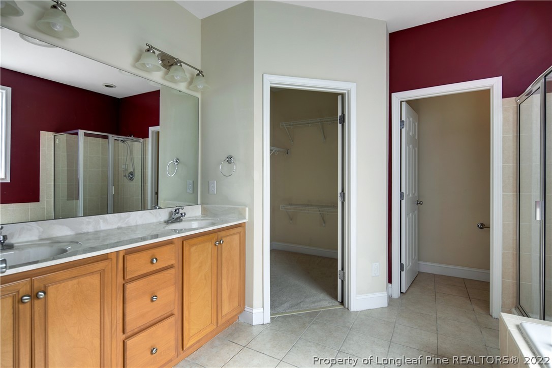 187 Lamplighter Way Spring Lake, NC 28390 - Photo 26 of 48 a bathroom with a granite countertop sink mirror and a