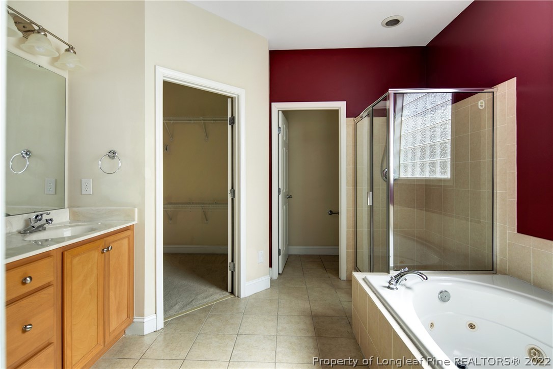 187 Lamplighter Way Spring Lake, NC 28390 - Photo 28 of 48 a bathroom with a bathtub and a sink