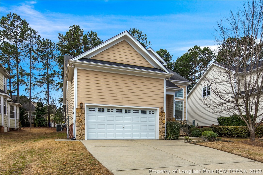187 Lamplighter Way Spring Lake, NC 28390 - Photo 3 of 48 a view of a house with a yard