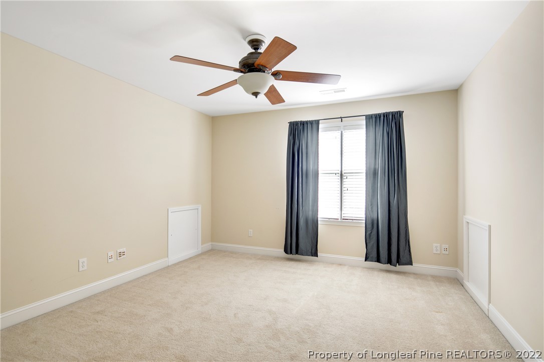 187 Lamplighter Way Spring Lake, NC 28390 - Photo 40 of 48 an empty room with windows and fan