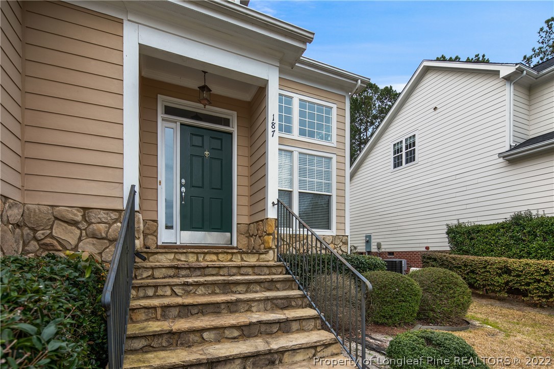 187 Lamplighter Way Spring Lake, NC 28390 - Photo 4 of 48 a front view of a house with a garden