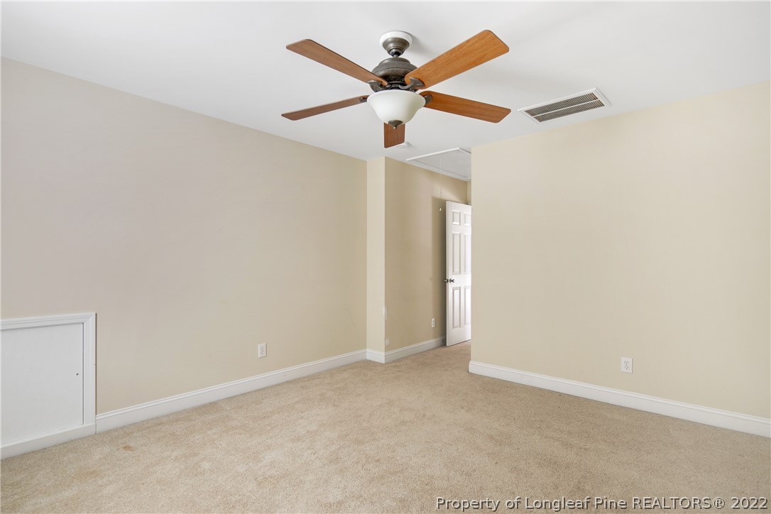 187 Lamplighter Way Spring Lake, NC 28390 - Photo 42 of 48 an empty room with ceiling fan and window