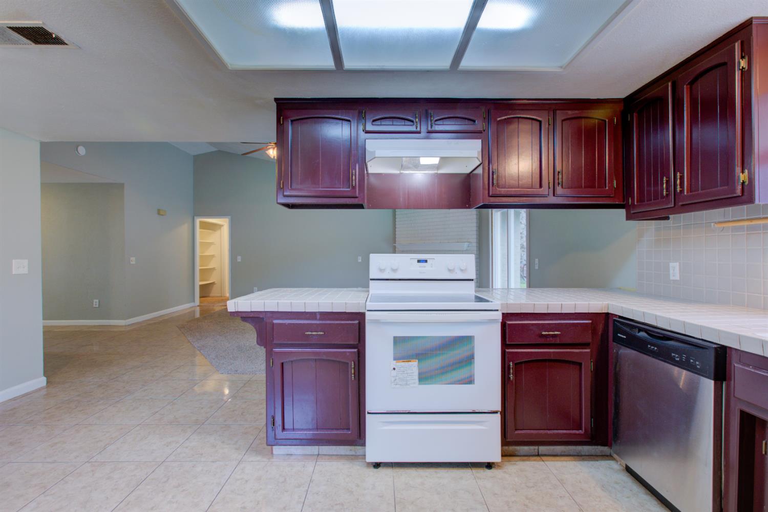 3772 Duke Court Merced, CA 95348 - Photo 11 of 40 a stove top oven sitting inside of a kitchen