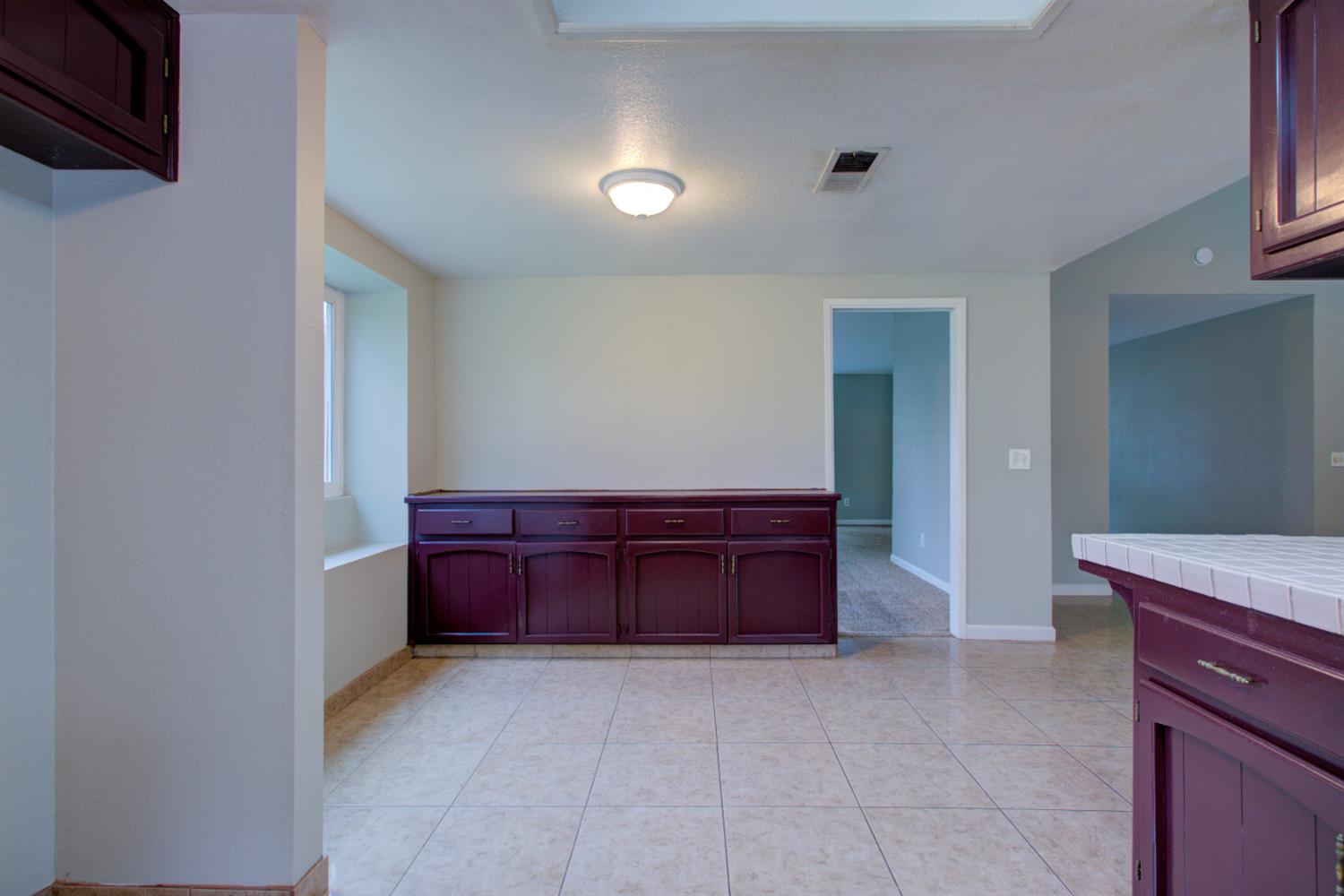 3772 Duke Court Merced, CA 95348 - Photo 16 of 40 a spacious bathroom with a granite countertop sink a mirror and bathtub