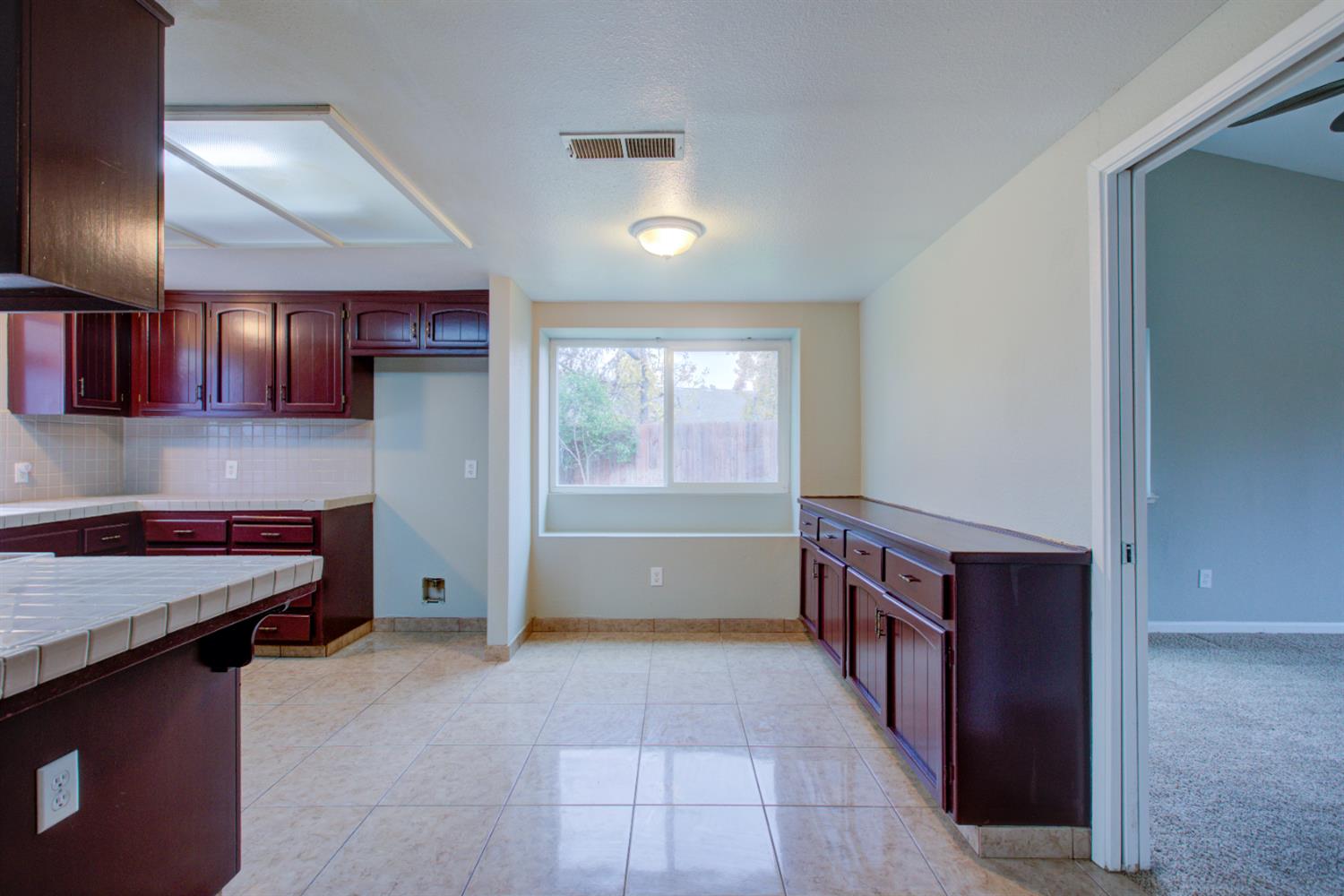 3772 Duke Court Merced, CA 95348 - Photo 17 of 40 a kitchen with granite countertop a stove and a sink