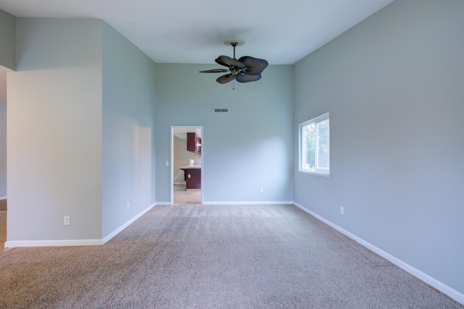 3772 Duke Court Merced, CA 95348 - Photo 19 of 40 wooden floor in an empty room with a window