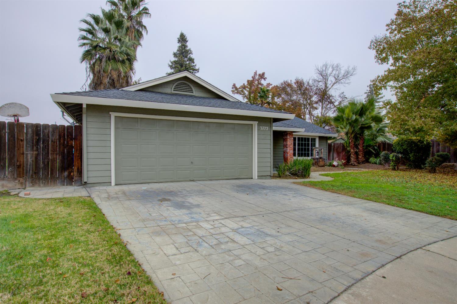3772 Duke Court Merced, CA 95348 - Photo 2 of 40 a front view of a house with a yard and garage