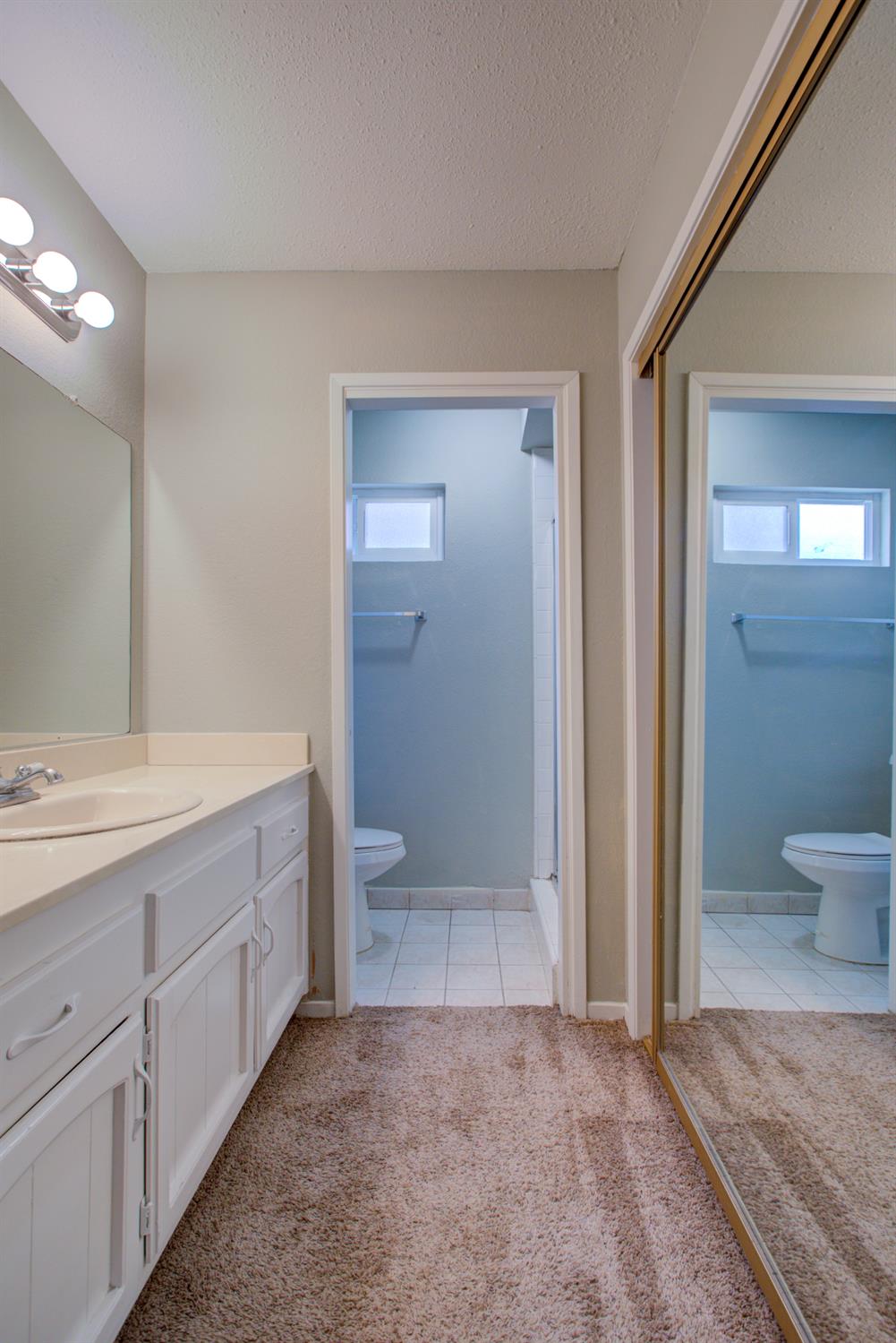3772 Duke Court Merced, CA 95348 - Photo 28 of 40 a bathroom with a sink a toilet and shower