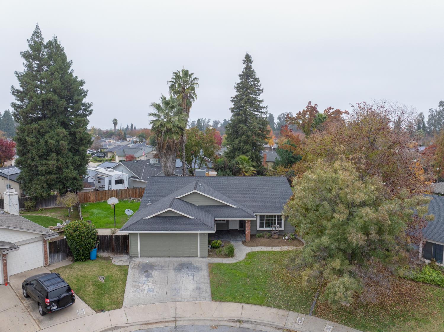 3772 Duke Court Merced, CA 95348 - Photo 40 of 40 a front view of a house with a garden and trees