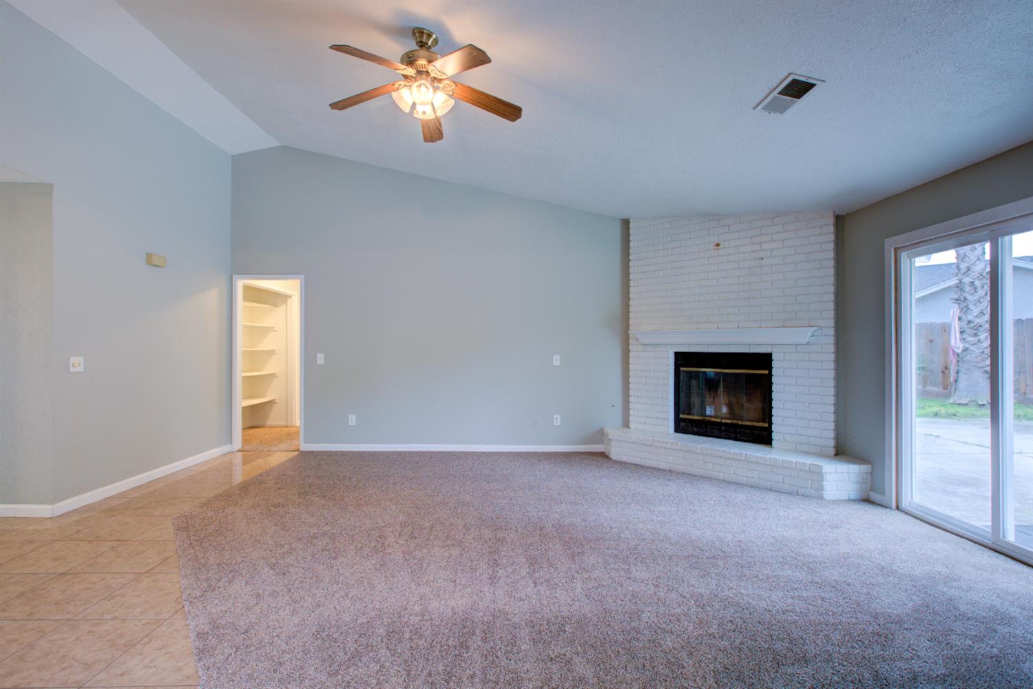 3772 Duke Court Merced, CA 95348 - Photo 5 of 40 a view of empty room with a fireplace
