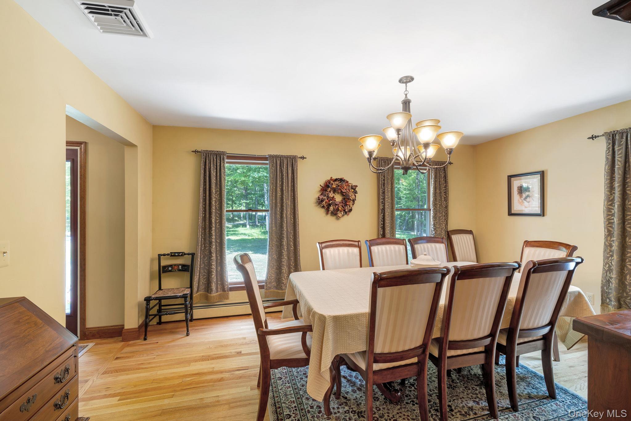339 Kirbytown Road Middletown, NY 10940 - Photo 13 of 44 a view of a dining room with furniture and a chandelier
