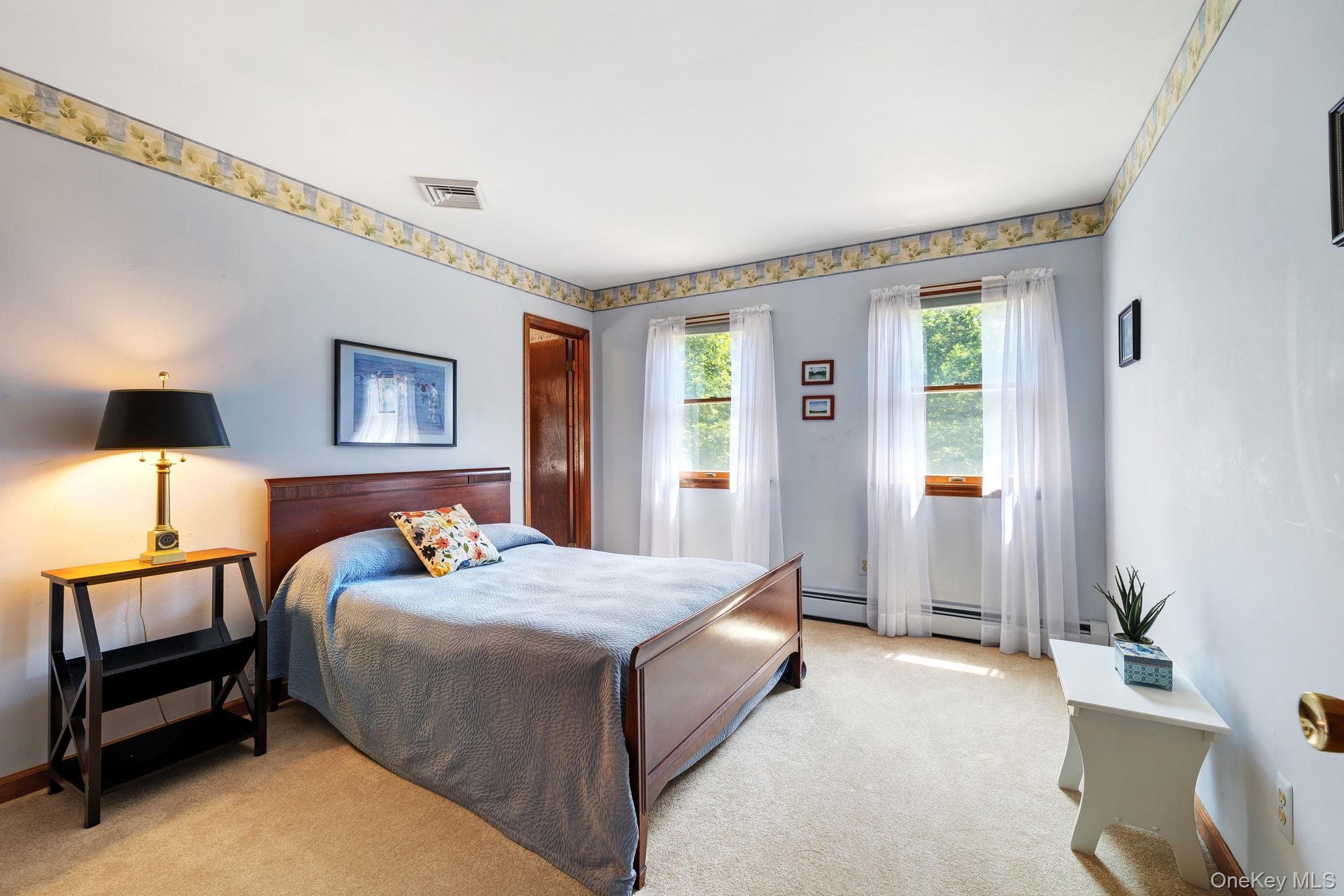 339 Kirbytown Road Middletown, NY 10940 - Photo 23 of 44 a bedroom with a bed and a lamp