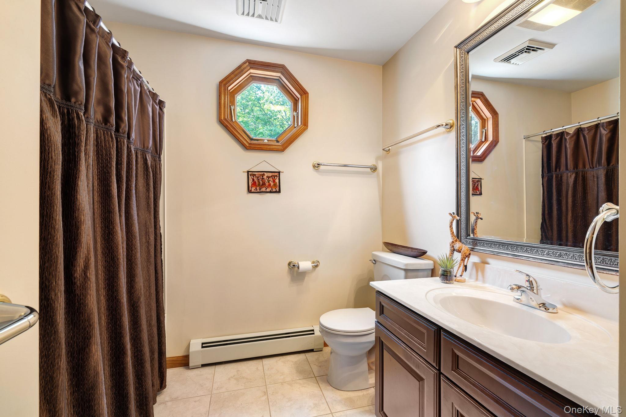339 Kirbytown Road Middletown, NY 10940 - Photo 26 of 44 a bathroom with a toilet sink and mirror