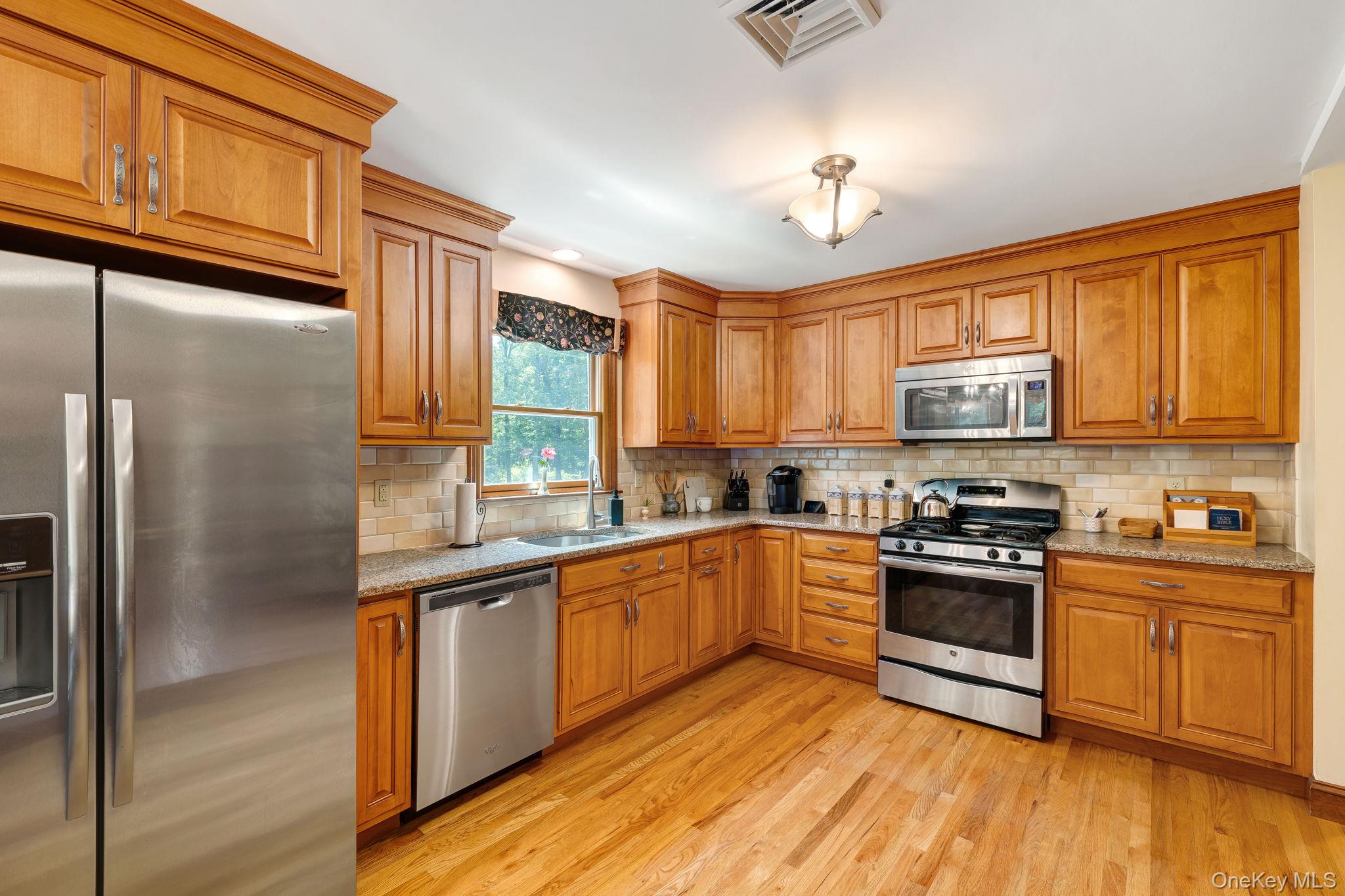 339 Kirbytown Road Middletown, NY 10940 - Photo 5 of 44 a kitchen with stainless steel appliances granite countertop a stove a sink dishwasher and a refrigerator