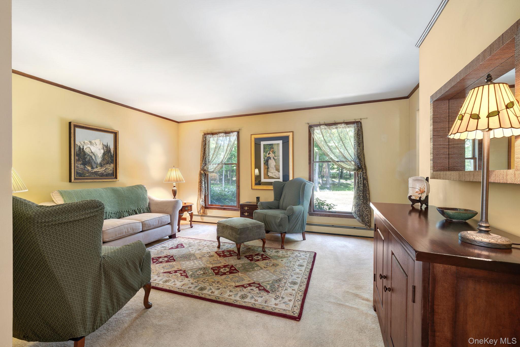 339 Kirbytown Road Middletown, NY 10940 - Photo 8 of 44 a living room with furniture large windows and wooden floor