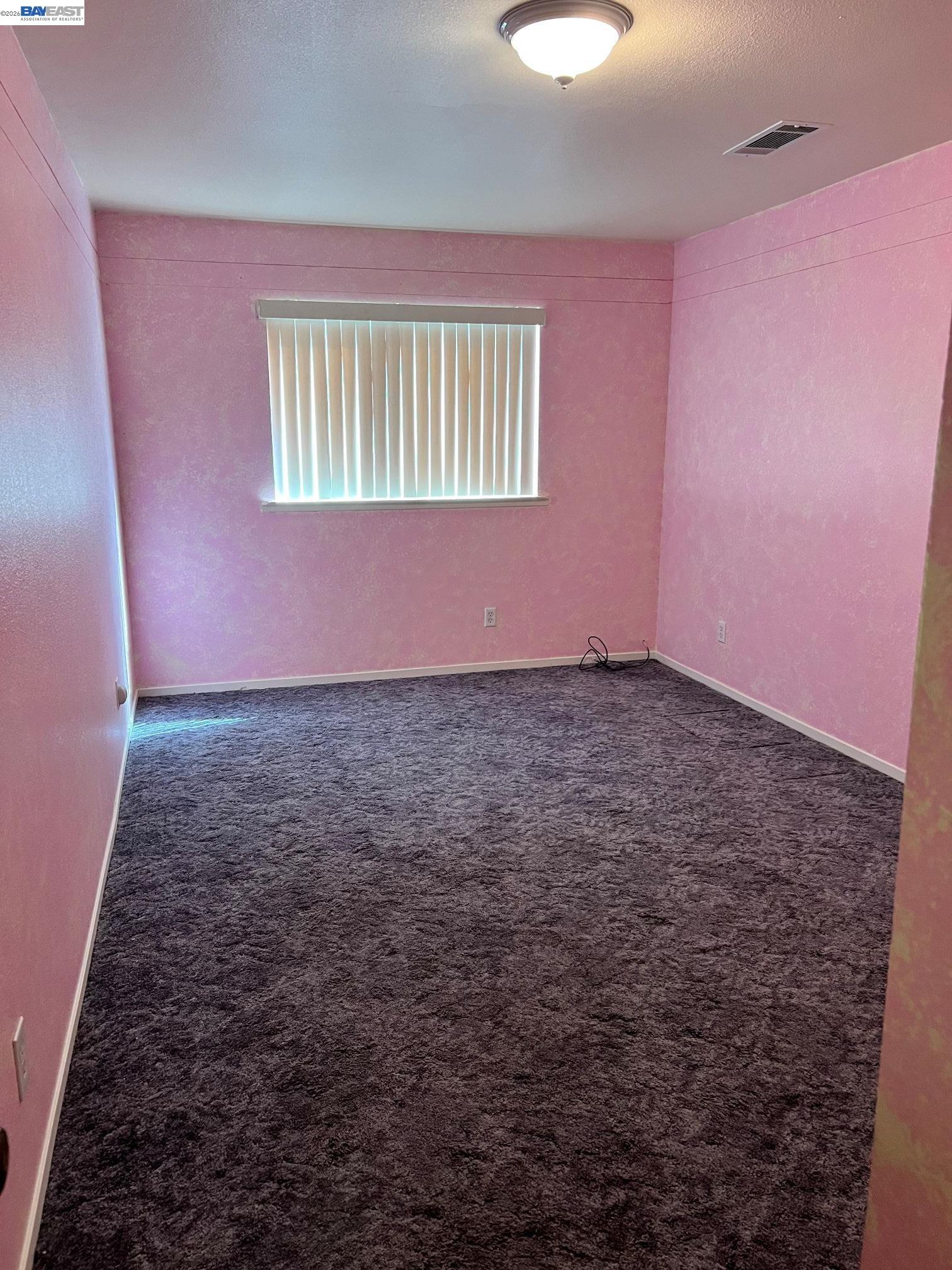 192 Torvend Way Patterson, CA 95363 - Photo 11 of 29 a view of an empty room with a window