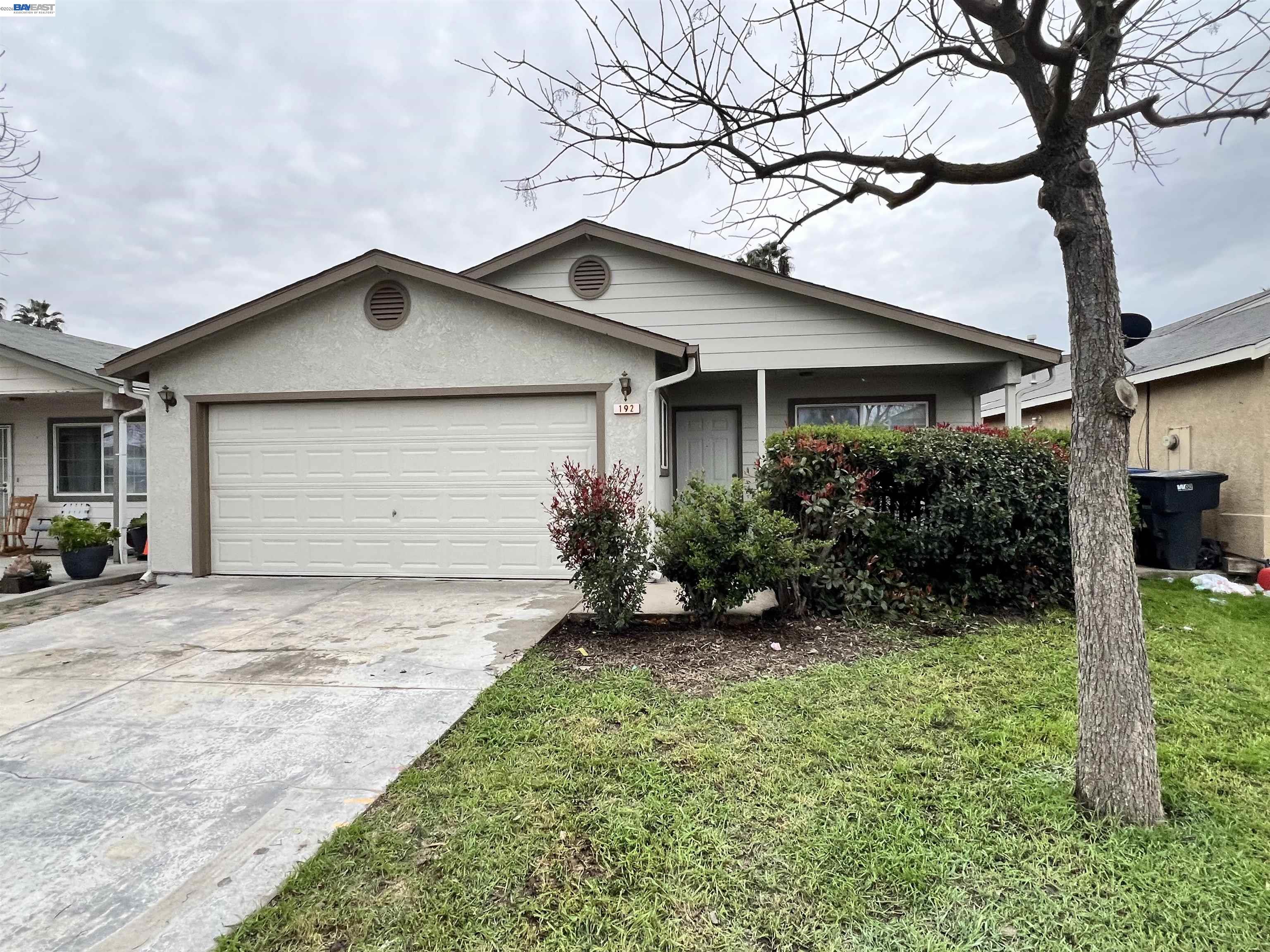 192 Torvend Way Patterson, CA 95363 - Photo 2 of 29 a front view of house with yard and green space