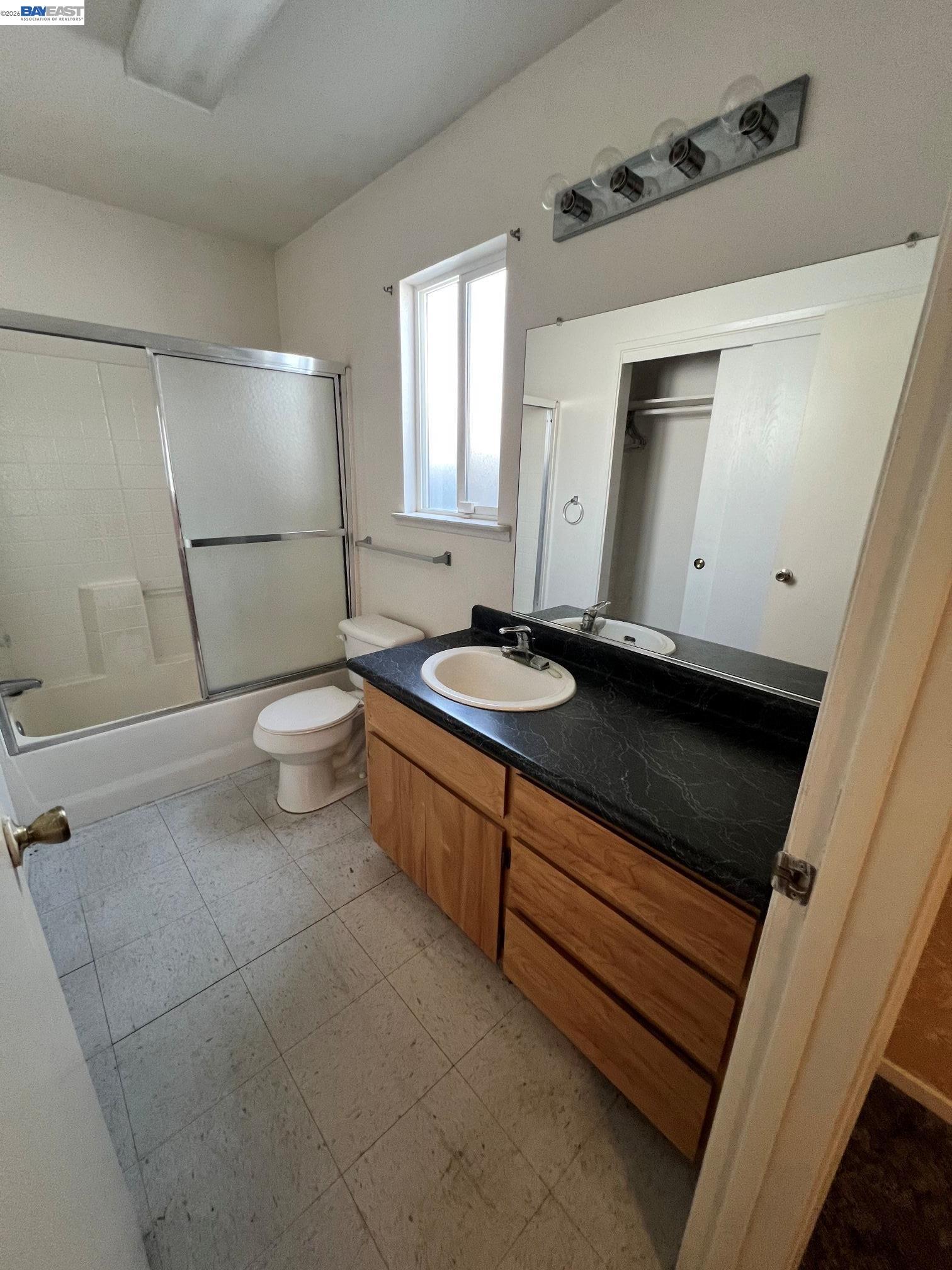 192 Torvend Way Patterson, CA 95363 - Photo 21 of 29 a bathroom with a sink a toilet and a mirror