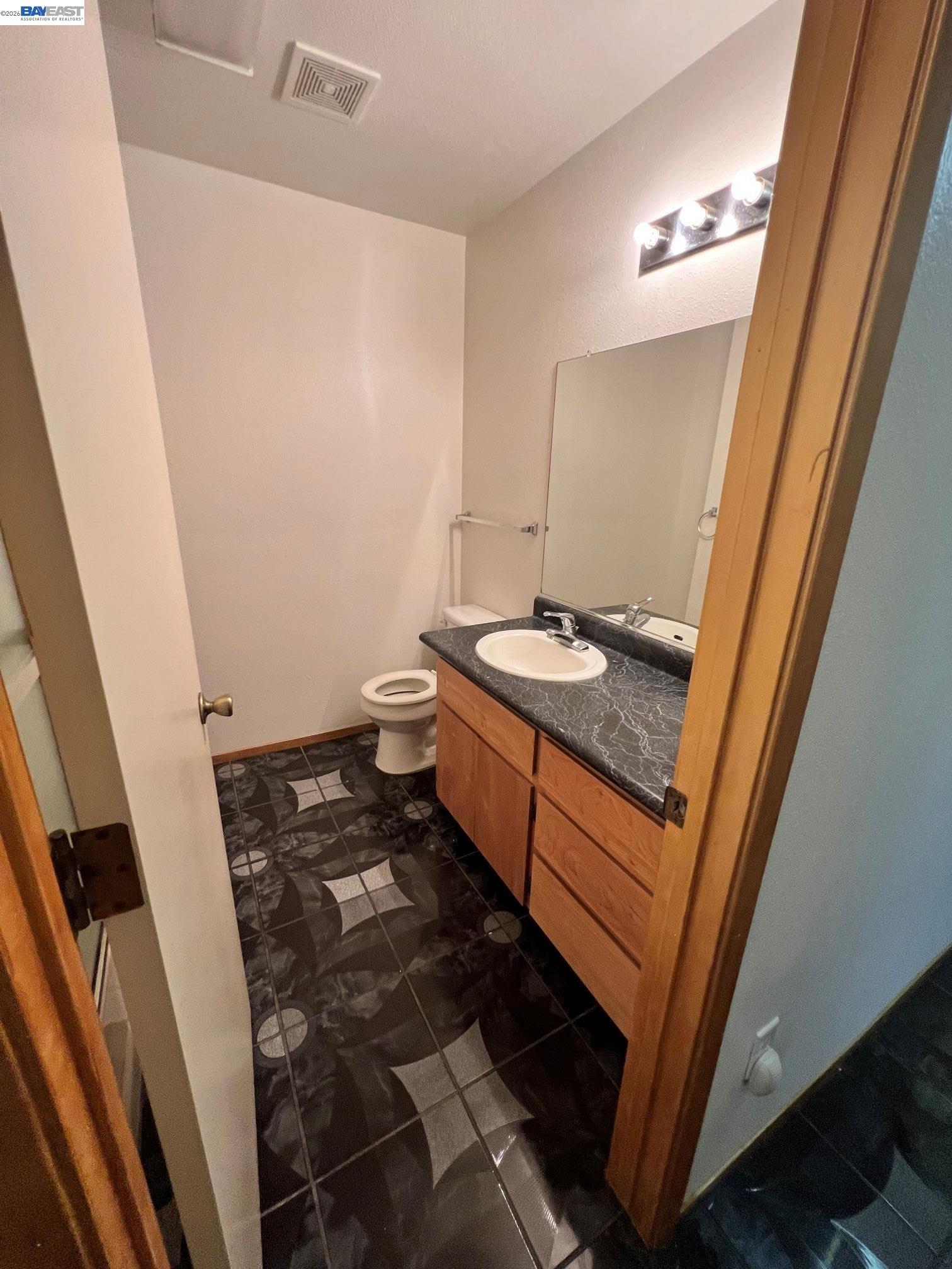 192 Torvend Way Patterson, CA 95363 - Photo 24 of 29 a bathroom with sink and mirror