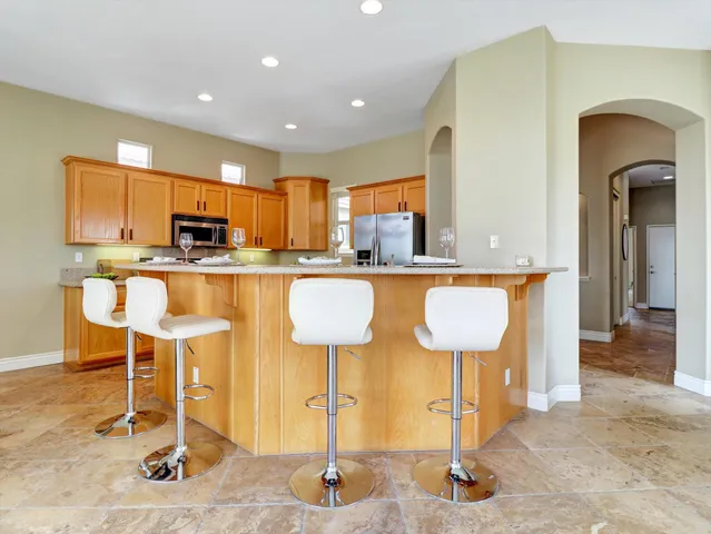 a kitchen with a sink stove and microwave