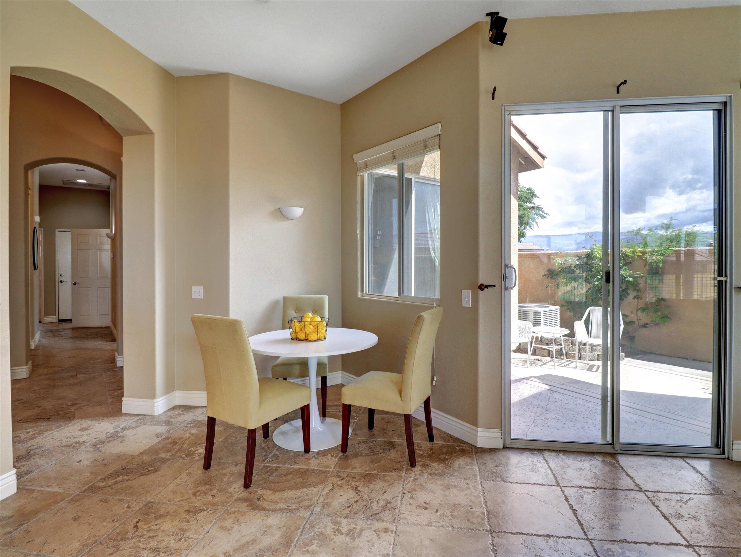 82809 Odlum Drive Indio, CA 92201 - Photo 17 of 57 a view of a dining room with furniture wooden floor and next to a window