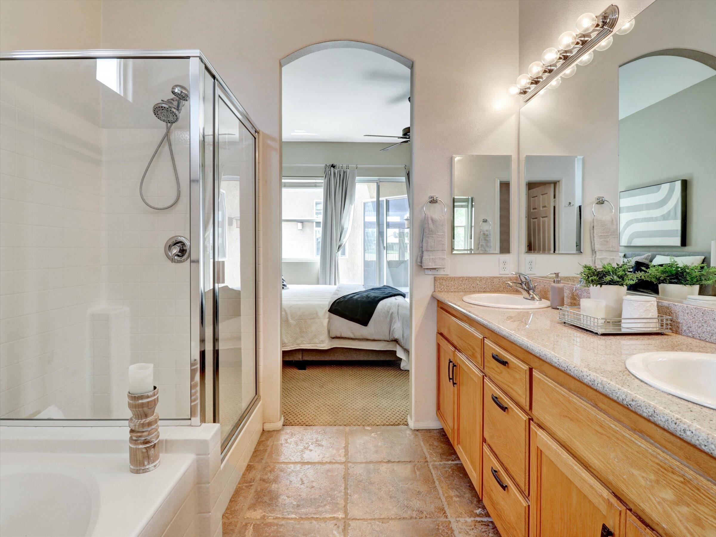 82809 Odlum Drive Indio, CA 92201 - Photo 27 of 57 a en suite spacious bathroom with a tub shower and mirror