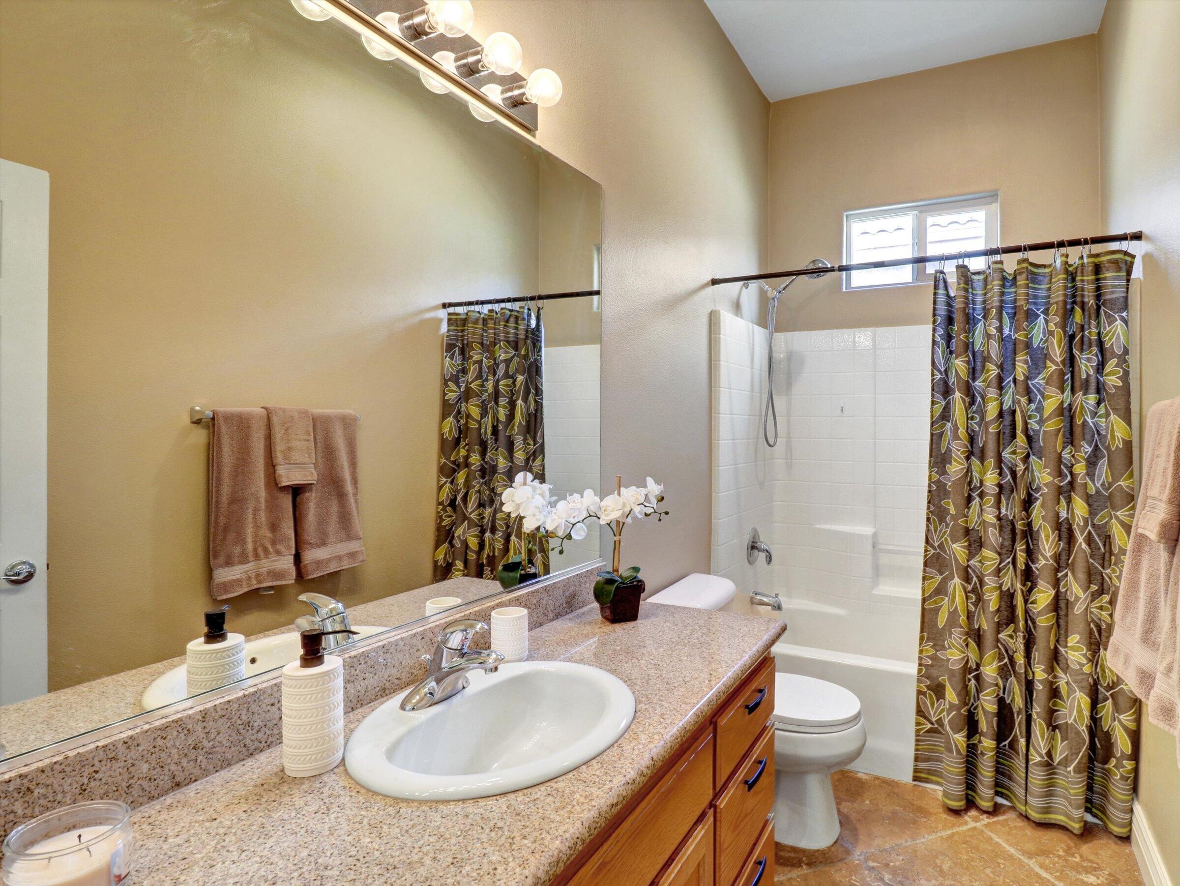 82809 Odlum Drive Indio, CA 92201 - Photo 30 of 57 a bathroom with a sink toilet and shower