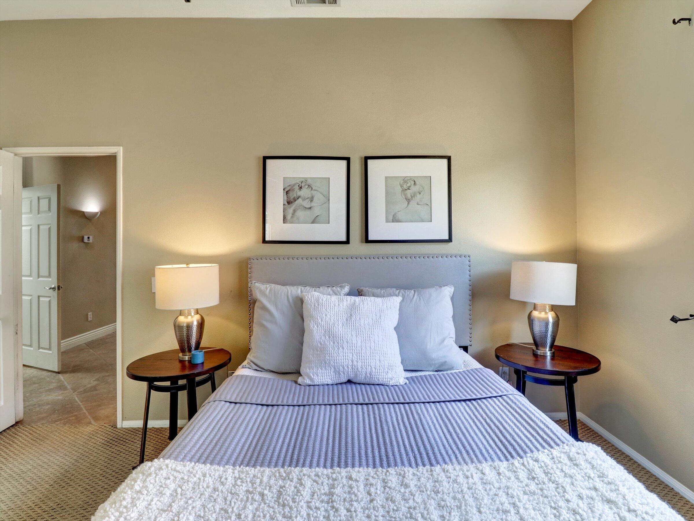 82809 Odlum Drive Indio, CA 92201 - Photo 33 of 57 a bedroom with a bed and a lamp