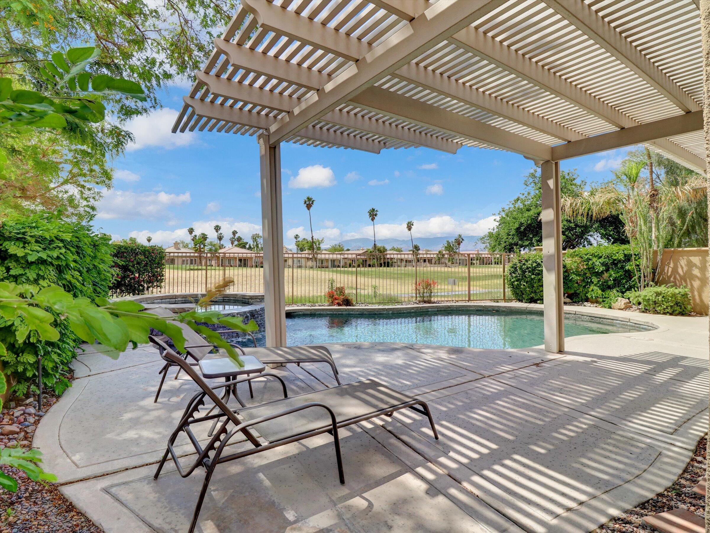 82809 Odlum Drive Indio, CA 92201 - Photo 39 of 57 a view of a swimming pool with a patio