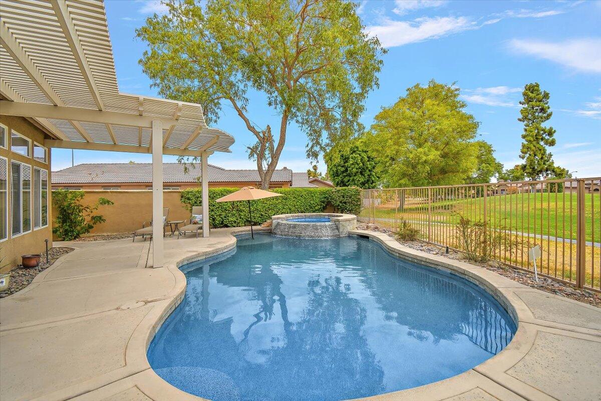 82809 Odlum Drive Indio, CA 92201 - Photo 41 of 57 a view of a swimming pool with an outdoor seating