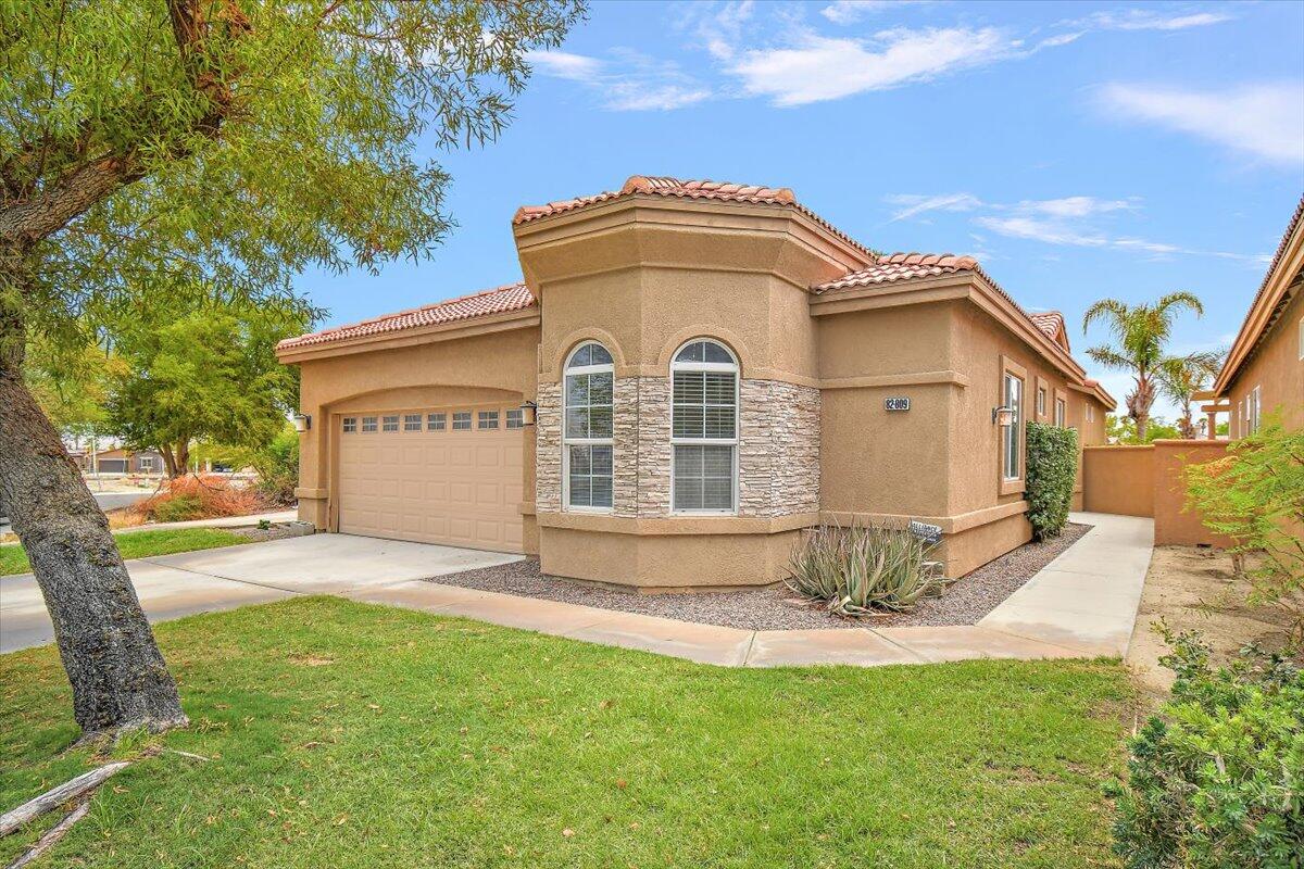 82809 Odlum Drive Indio, CA 92201 - Photo 57 of 57 a front view of a house with a yard