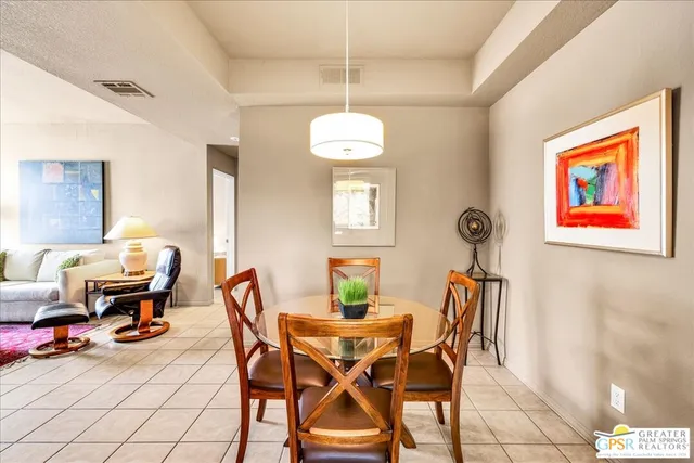 a dining room with furniture and window