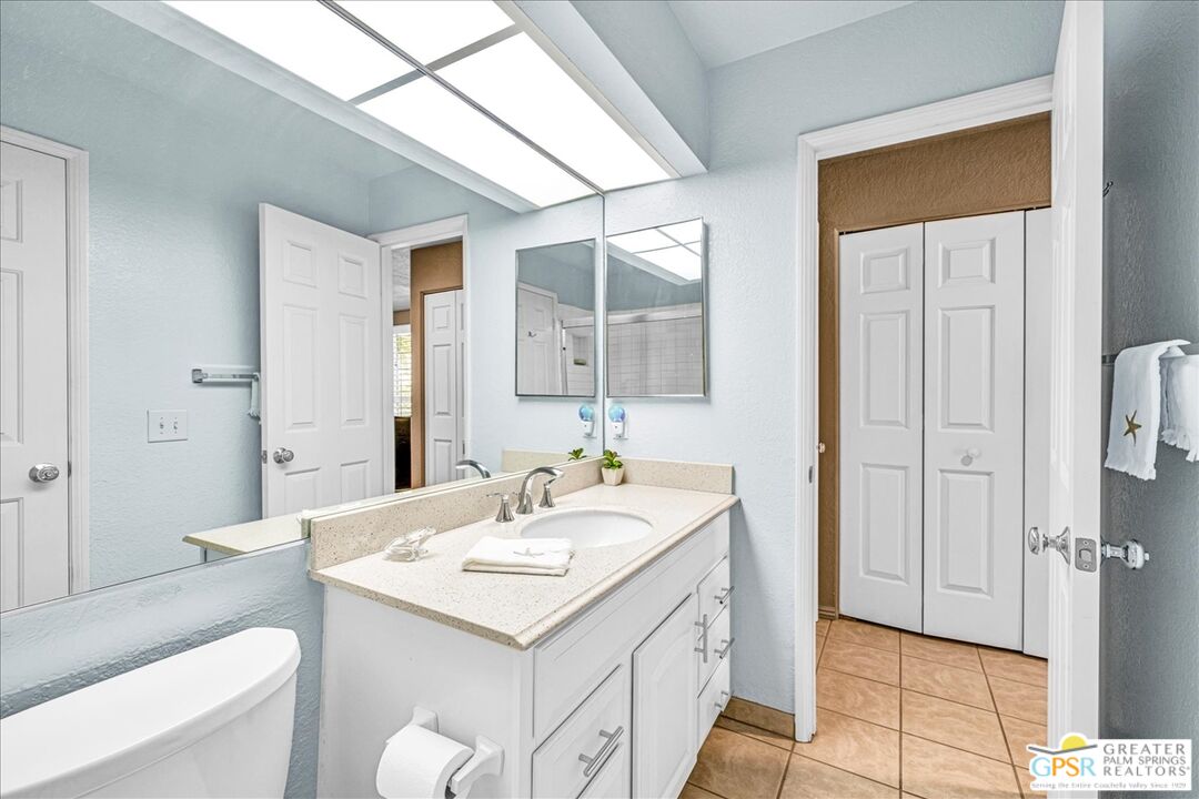 401 El Cielo Road, Unit 227 Palm Springs, CA 92262 - Photo 14 of 43 a bathroom with a sink and a mirror