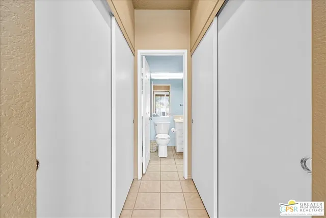 a view of a hallway with toilet