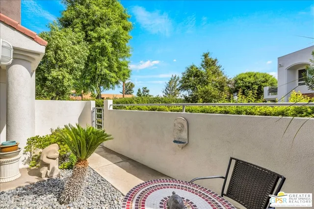 a view of balcony with furniture