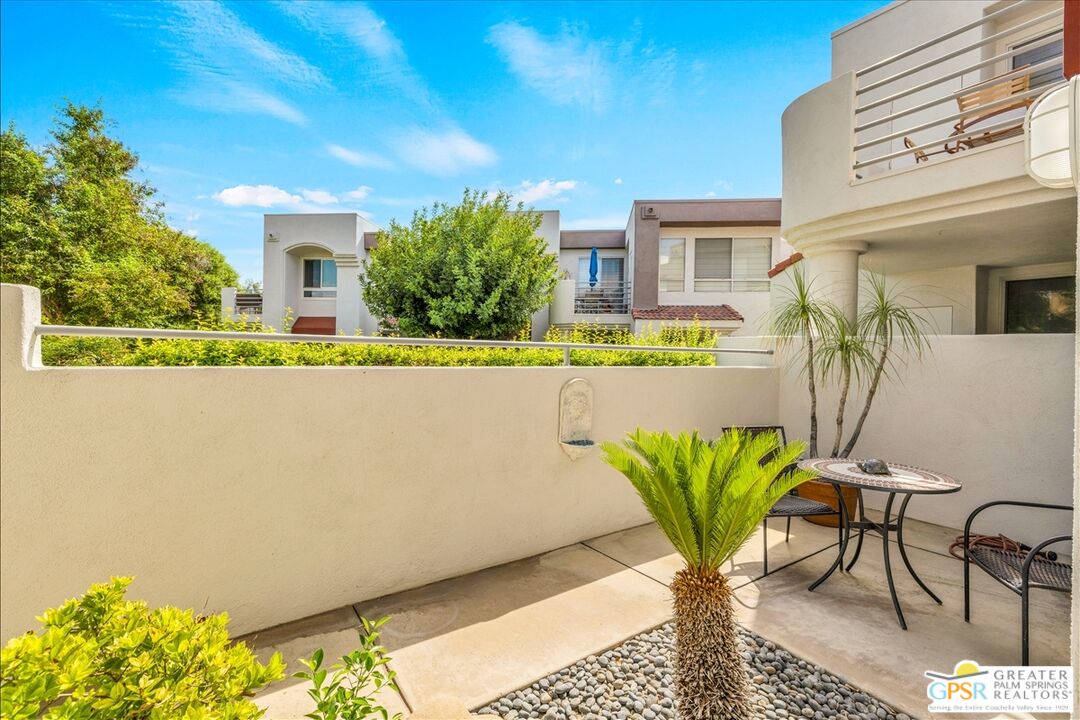 401 El Cielo Road, Unit 227 Palm Springs, CA 92262 - Photo 27 of 45 a view of a chairs and table in a patio
