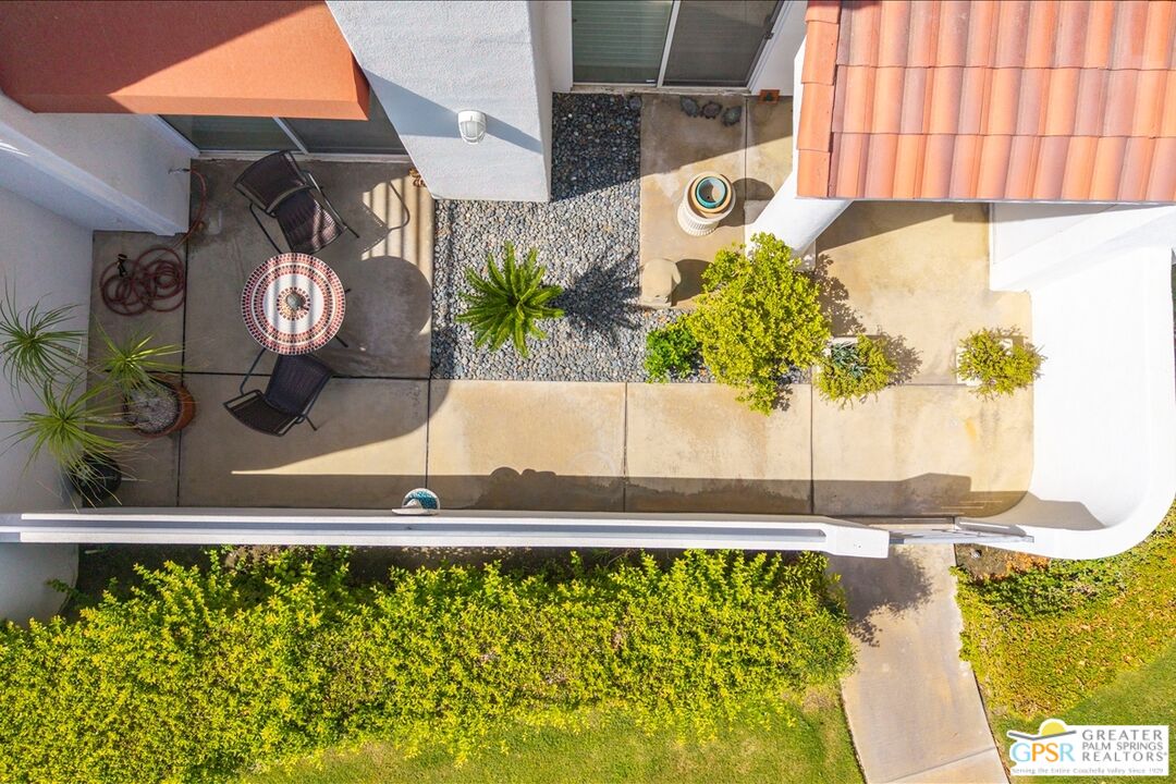 401 El Cielo Road, Unit 227 Palm Springs, CA 92262 - Photo 29 of 43 a front view of a house with a yard
