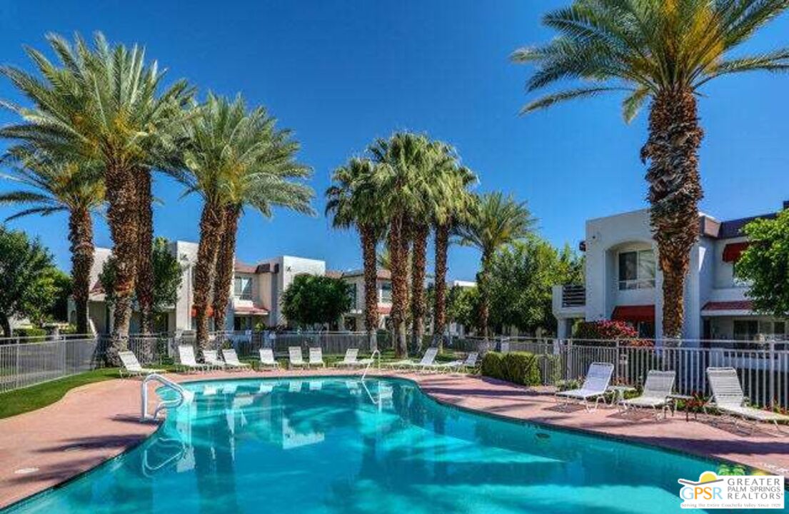 401 El Cielo Road, Unit 227 Palm Springs, CA 92262 - Photo 34 of 43 a view of a house with swimming pool and sitting area