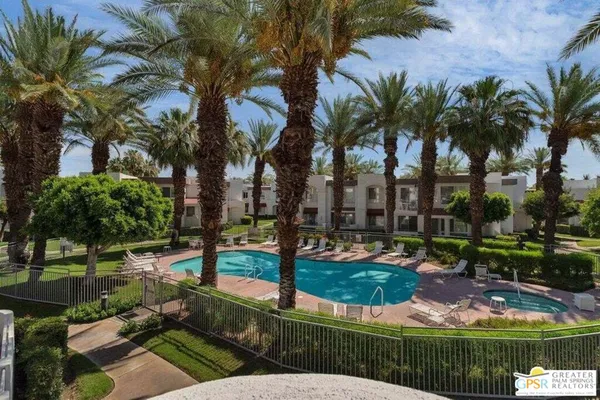 a view of a park with palm trees