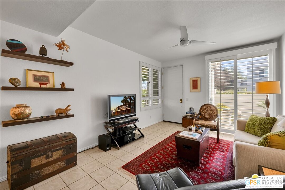 401 El Cielo Road, Unit 227 Palm Springs, CA 92262 - Photo 4 of 43 a living room with furniture and a window