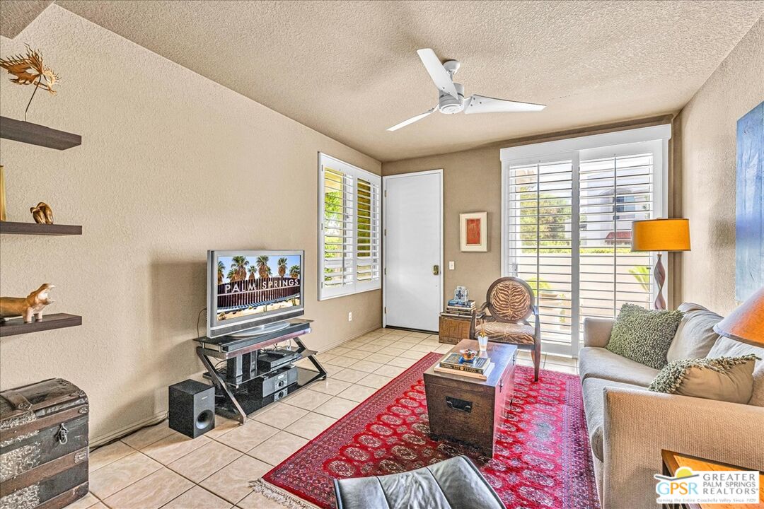 401 El Cielo Road, Unit 227 Palm Springs, CA 92262 - Photo 4 of 45 a living room with furniture and a large window